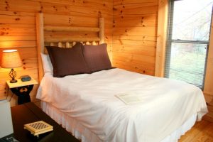 An extremely comfortable bed in the Rocky Broad River Cabin.